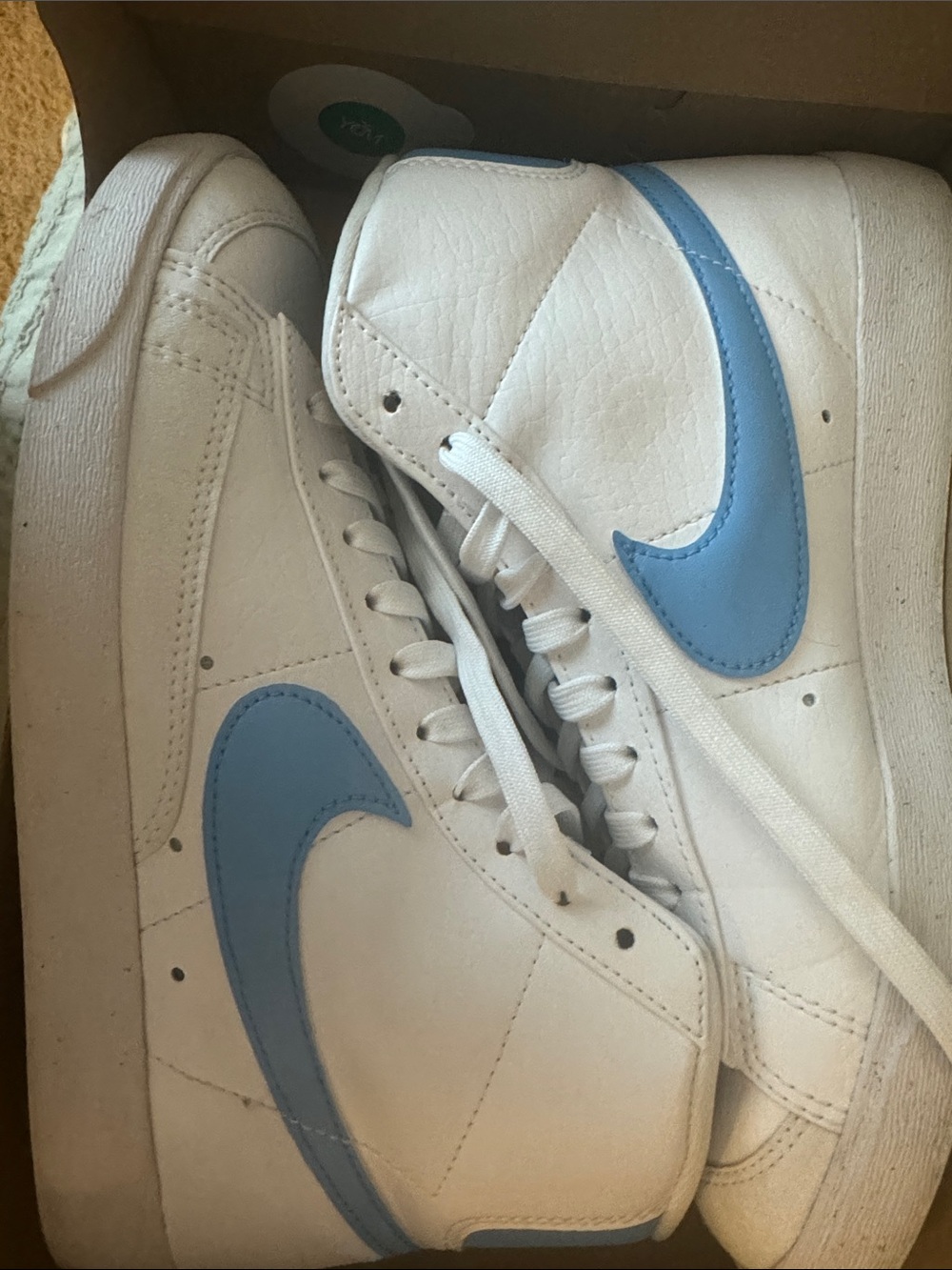 Nike White High-Top Sneakers with Light Blue Swoosh